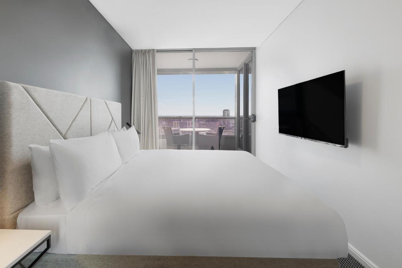 Meriton Suites Zetland Sydney Exterior foto A bedroom at the hotel